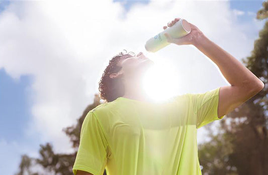 article_image Athlete drinking Liquid I.V. from a bottle after soccer to prevent signs of dehydration